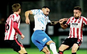 Barrow’s Kane Hemmings battles with Luke Young