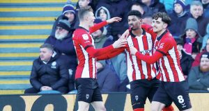Reeco Hackett celebrates scoring Lincoln City’s first goal