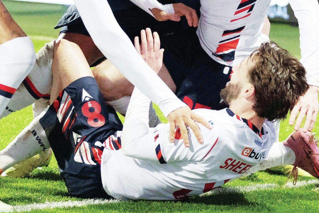 Bolton’s Josh Sheehan is mobbed after his dramatic late winner