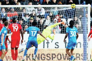 Leyton Orient keeper Tommy Simkin makes a flying save before half-time