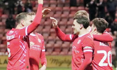 Josh March is congratulated by his teammates
