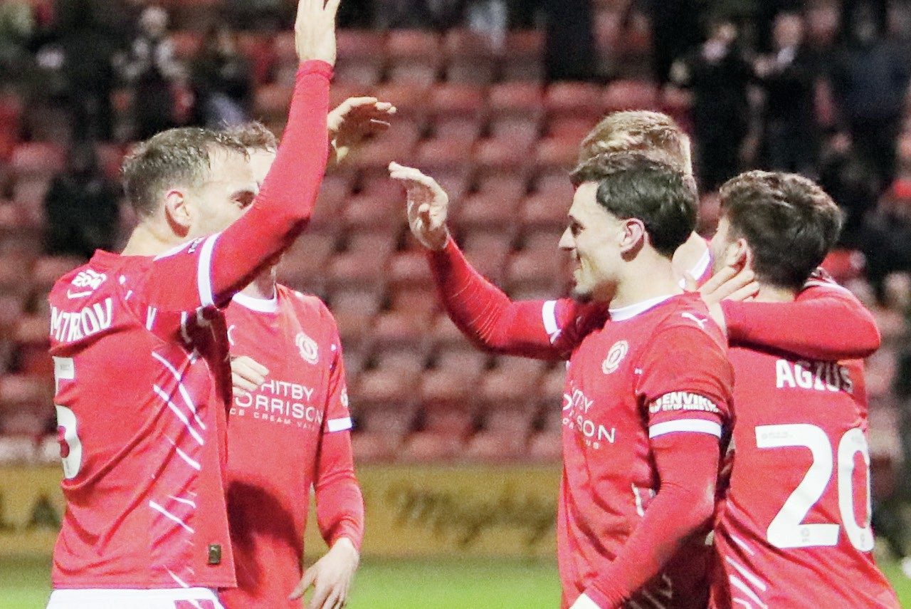 Josh March is congratulated by his teammates