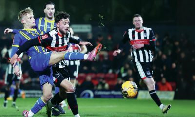 Grimsby Town’s Reece Staunton, right, and Weston-super-Mare’s Will Dawes battle for the ball