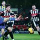 Grimsby Town’s Reece Staunton, right, and Weston-super-Mare’s Will Dawes battle for the ball