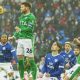 Stockport County midfielder Oliver Norwood rises high and heads clear