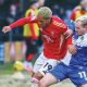 Bristol Rovers’ Luke Thomas, right, battles with Salford City’s Haji Mnoga
