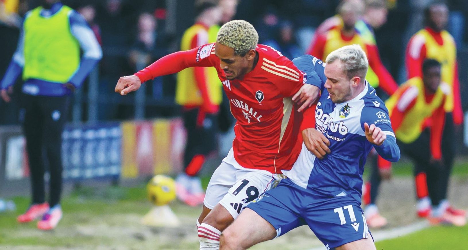 Bristol Rovers’ Luke Thomas, right, battles with Salford City’s Haji Mnoga
