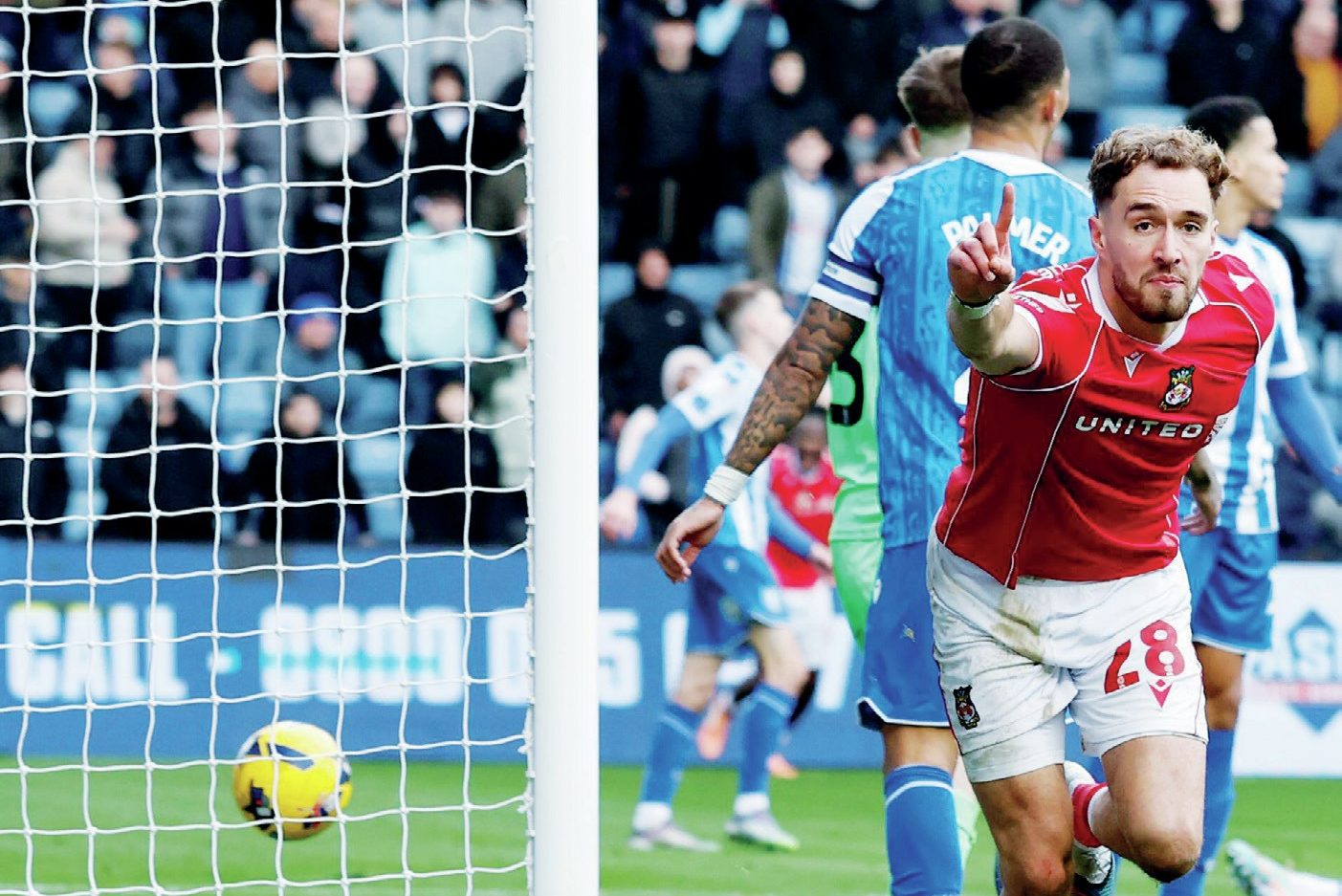 Wrexham’s Sam Smith celebrates his winner