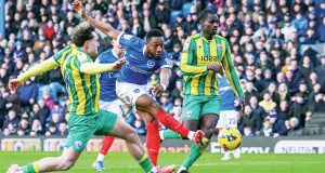 Ebou Adams fires home Portsmouth’s third goal