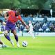 Gillingham’s Garath McCleary earns a penalty against Bromley