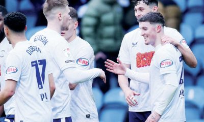 Preston North End’s Alfie Devine, right, celebrates with team-mates after scoring their goal