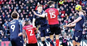 Sam Dalby, right, rises high to score Bolton Wanderers’ leveller