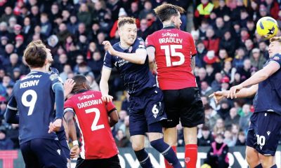 Sam Dalby, right, rises high to score Bolton Wanderers’ leveller