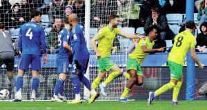 Norwich City’s Ali Ahmed, right, celebrates scoring their clinching second goal