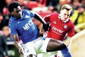 Watford’s James Abankwah, left, and Bristol City’s Scott Twine battle for the ball