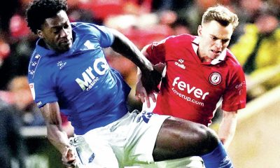 Watford’s James Abankwah, left, and Bristol City’s Scott Twine battle for the ball