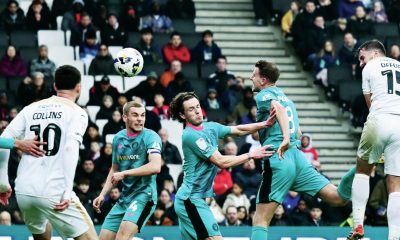 MK Dons’ Luke Offord, right, makes it 2-1