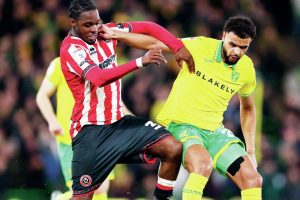 TALENT: Norwich City’s Anis Ben Slimane holds off Sheffield United’s Femi Seriki in the 2-1 midweek win and, inset, recent signing Paris Maghoma