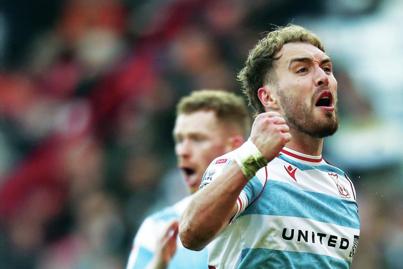 Wrexham’s Sam Smith celebrates his winner