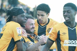 Cambridge United’s James Gibbons, second left, takes the acclaim for his winner