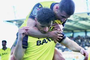 Cameron Brannagan congratulates Oxford Unitd goalscorer Mark Harris