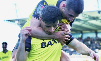 Cameron Brannagan congratulates Oxford Unitd goalscorer Mark Harris