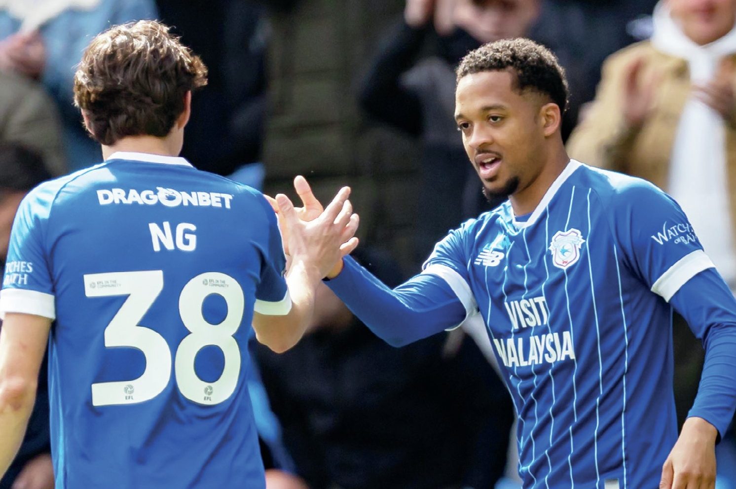 Cardiff City’s Chris Willock, right, celebrates his goal with Perry Ng