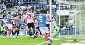 Ibane Bowat, partially hidden, scores Portsmouth’s winner past Asmir Begovic