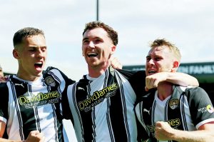 Notts County’s Conor Grant celebrates his equaliser with his teammates.